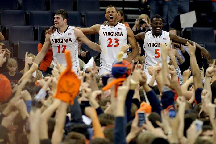 Joe Harris, Justin Anderson, and Teven Jones celebrate Virginia's win over No. 3 Duke.